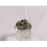 10CT AMERICAN DIAMOND RING. 10ct white gold American diamond set flower ring, size L