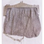 SILVER AND CHAINMAIL BAG. 800 silver and chainmail bag in cherub and floral detail, A/F