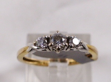 9CT DIAMOND RING. 9ct gold 0,25ct three stone diamond ring, size K/L