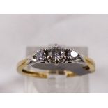 9CT DIAMOND RING. 9ct gold 0,25ct three stone diamond ring, size K/L