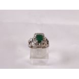 18CT DIAMOND RING. 18ct white gold emerald and diamond ring