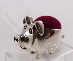 SILVER PIN CUSHION. Silver pig pin cushion