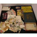 STAMPS - a collection of British and World stamps to include three stamp albums and a number of