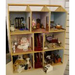 DOLLS HOUSE - a dolls house containing dolls and furniture set over 3 floors,