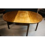 DINING TABLE - a Victorian Sutherland oval drop leaf, gate leg dining room table. Sun-bleached.