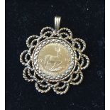 KRUGERRAND - a 1/10th 1982 Krugerrand coin mounted in a 9ct gold pendant. Total weight 7.