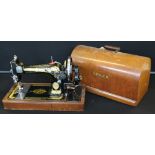 SINGER - a Singer Manufacturing sewing machine in original box with key, serial number EB607697.