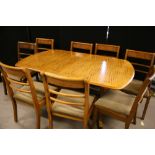 DINING TABLE & CHAIRS - a Nathan extending dining table including 8 matching draylon covered dining