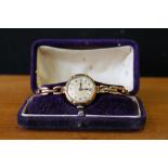 9CT LADIES WATCH - a 9ct gold ladies mechanical watch with expander bracelet,