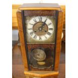 CLOCK - a 20th century mantle clock with mechanical features. Includes key.