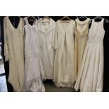 WEDDING DRESSES - a collection of 7 wedding dresses (with tags) to include a white sequin and