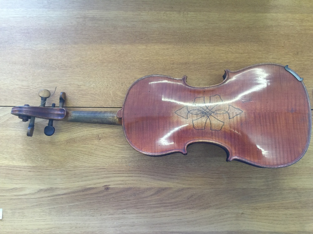 VIOLIN - a cased copy of a Joseph Guarnerius violin with a bow featuring mother of pearl inlay. - Image 3 of 5