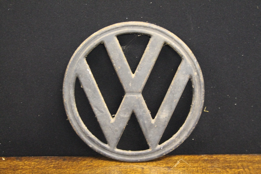 VW AUTOMOTIVE EMBLEM - an original metal Volkswagon emblem, from an original Volkswagon camper van.