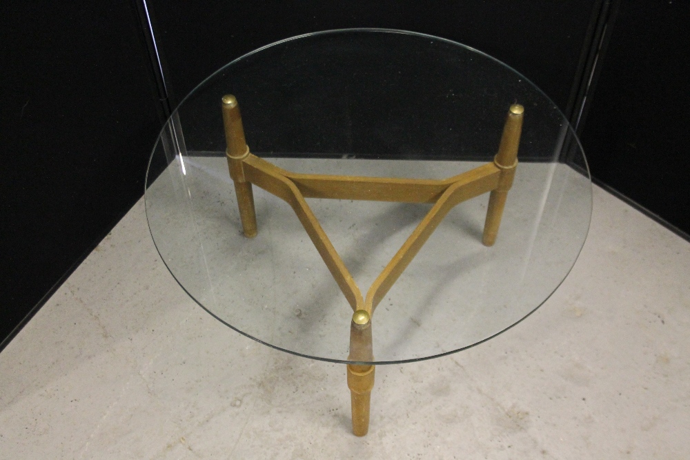 GLASS COFFEE TABLE - a round glass coffee table with wooden three legged base, measuring 30"dx16"h. - Image 2 of 2