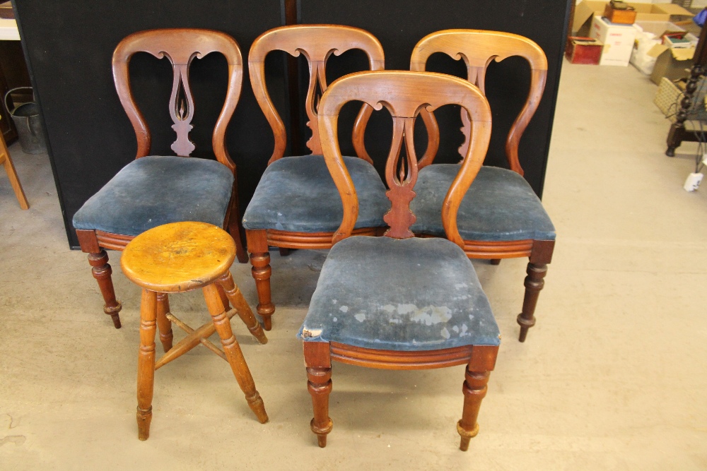 DINING CHAIRS - a set of 4 wooden dining chairs with curved backs. Cushions covered in blue fabric.