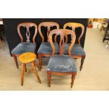 DINING CHAIRS - a set of 4 wooden dining chairs with curved backs. Cushions covered in blue fabric.