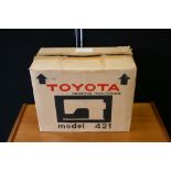 TOYOTA SEWING MACHINE - a Toyota model 421 sewing machine in original box.