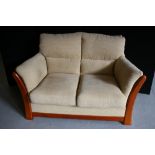 LOVE SEAT SOFA - a cream upholstered love seat sofa.