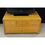 WOODEN TV CABINET - a modern wooden TV cabinet with one large drawer and three smaller drawers,