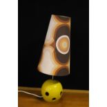 RETRO LAMP - a vintage yellow ceramic lamp base featuring circular holes and a tall retro print