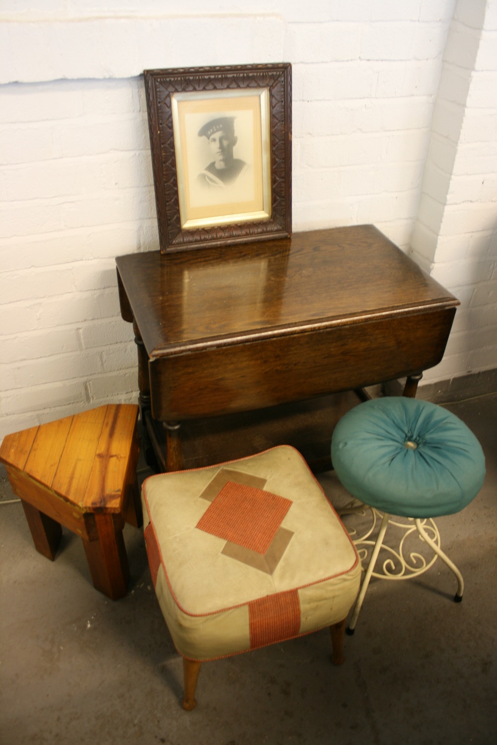 SIDE TABLE & STOOLS - an oak gate legged side table on castors, 3 individual stools - one wooden,