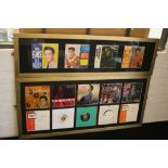 ELVIS SINGLES - 2 framed Elvis displays featuring a total of 14 7" singles.