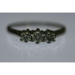 DIAMOND TRILOGY RING - three uniform brilliant cut diamonds (total approx weight 0.