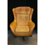 RETRO SWIVEL CHAIR - a retro egg swivel chair in mustard colour.