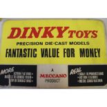 DINKY PROMOTIONAL MATERIAL - a Dinky double sided cardboard shop display and a metal Dinky Toys