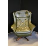 RETRO SWIVEL CHAIR - a retro egg swivel chair in green.