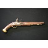 FLINTLOCK PISTOL - a flintlock pistol with brass furniture and steel parts.