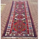 VINTAGE CAUCASIAN RUNNER - a vintage Caucasian runner, measuring 324x92cm.