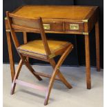 WRITING DESK - a leather topped writing desk with brass military handles and leather folding chair