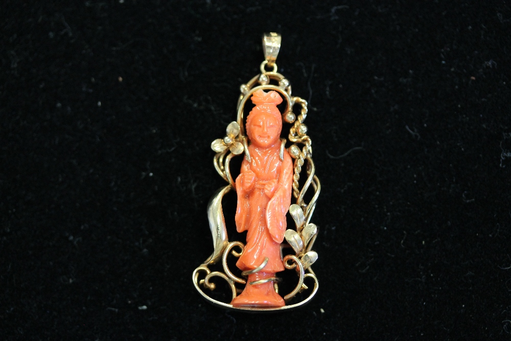 GEISHA PENDANT - a Geisha figure mounted in 14K gold. Stands at 4.5cm.