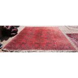 VINTAGE AFGHAN CARPET - a vintage Afghan carpet, measuring 318x259cm.