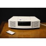 BOSE WAVE SYSTEM - a vintage Bose Wave Radio/CD system in white including original instructions.