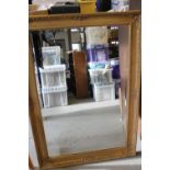 GILT MIRROR - a gilt mirror with bevel edges measuring 105x75cm.