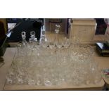 GLASSWARE - a large collection of cut glass and glassware to include 4 decanters, a sherry set,