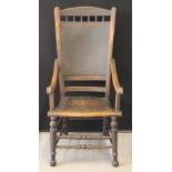 ANTIQUE WOODEN CHAIR - a late Victorian/Edwardian arm chair, with twin turned stretchers,