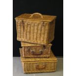 WICKER HAMPERS - 3 wicker picnic hampers of varying sizes. One includes a partial picnic set.