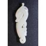 WHITE JADE - a Chinese white jade dragon pendant, measuring approximately 11cm and weighing 54.3g.