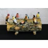 VALLAURIS POTTERY - an early 20th century pottery planter in the shape of 7 birds settled on a log,