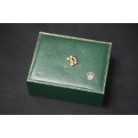 ROLEX - an original Rolex watch box with a gold bracelet link. Weight 3.9g.