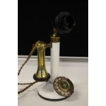 BRITISH CANDLESTICK TELEPHONE - a white and brass British Model 150 candlestick telephone in need