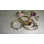 Six assorted silver rings all set with different semi precious stones