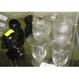 Assorted vintage cordial glasses and black glass monkey ornaments