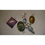 Collection of 5 modern hardstone and silver metal pendants