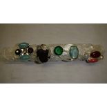 4 x modern silver metal rings set with semi precious hardstones