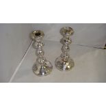 Pair of 19th century Sheffield plate candlesticks decorated with leaf and grape pattern