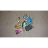 Collection of 5 modern hardstone and silver metal pendants